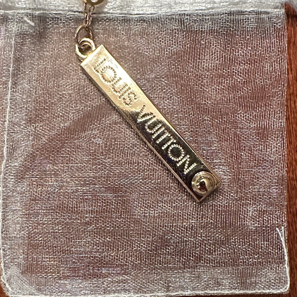 Authentic Louis Vuitton Large Lola bar charm on chain